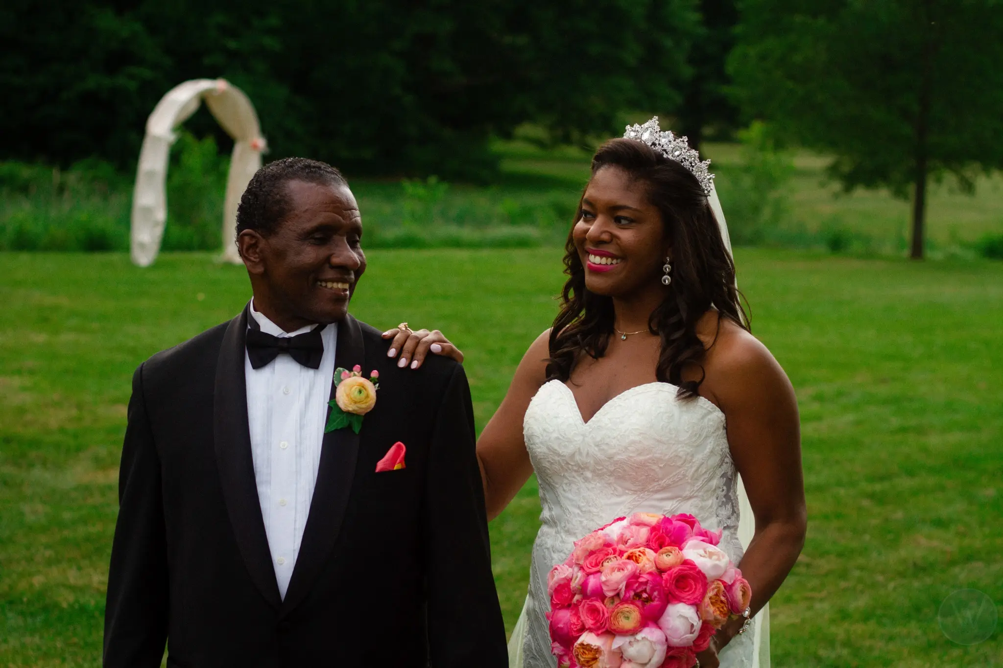 Newlyweds walking together through a garden